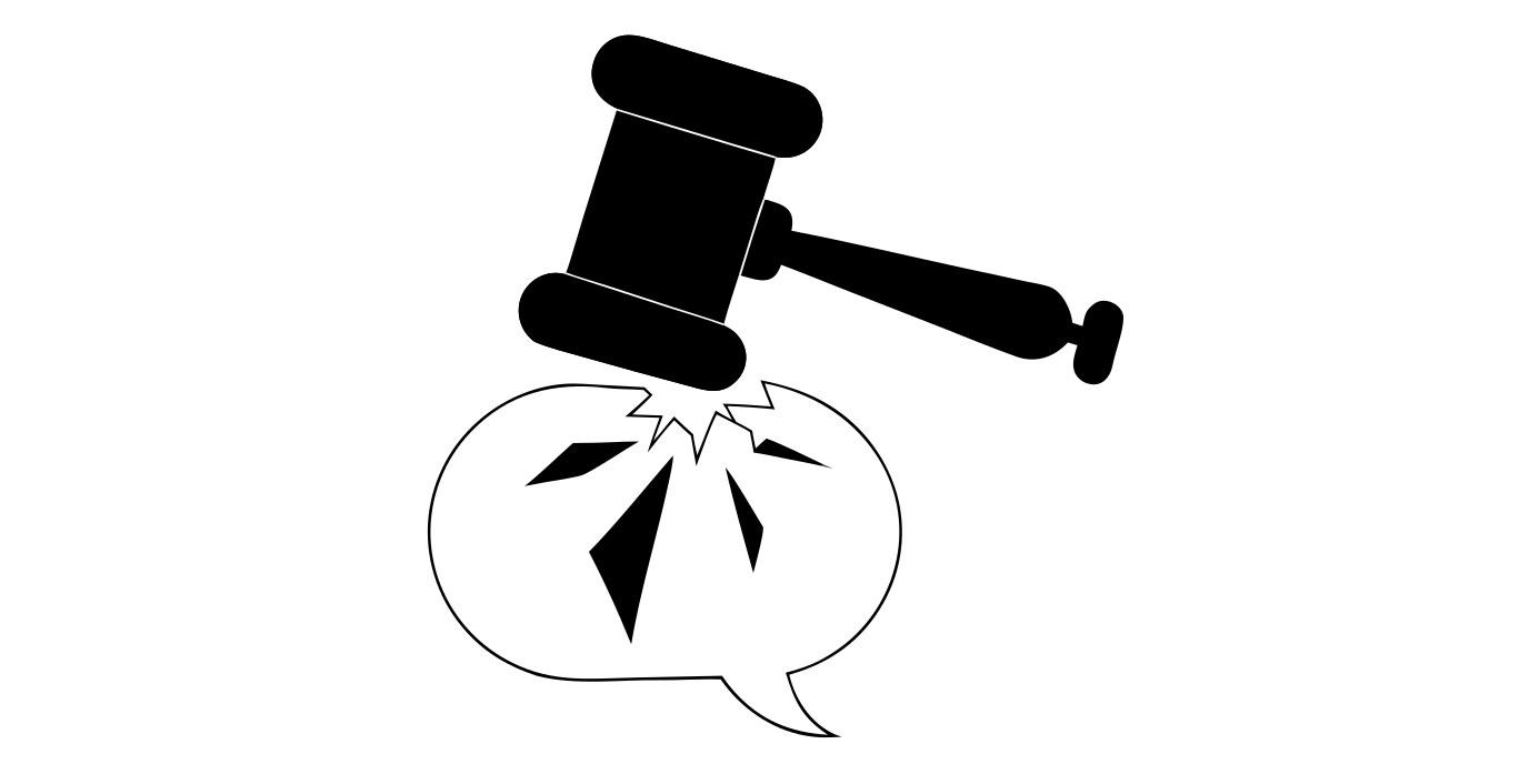 A judge's gavel coming down on a cracking speech bubble